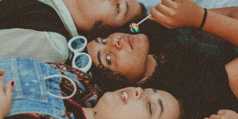 People smiling and relaxing after a group cardio session.